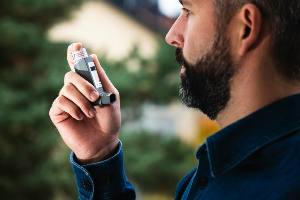 A man holding a cell phone up to his ear